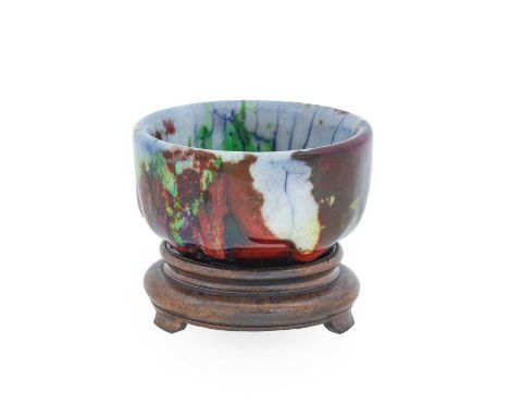 A Royal Doulton Chang Ware Bowl, by Charles Noke and Harry Nixon, the flambé ground covered with a viscous white, red, blue, 