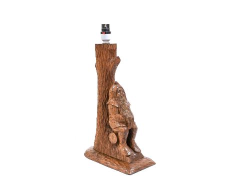 Gnomeman: Thomas Whittaker (1912-1991) (Littlebeck): An English Oak Table Lamp, with a carved gnome seated on a log at the bo