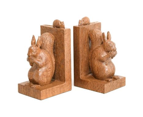 Workshop of Robert Mouseman Thompson (Kilburn): A Pair of Carved English Oak Red Squirrel Bookends, both sitting up on their 
