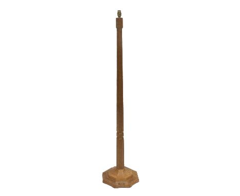 Workshop of Robert Mouseman Thompson (Kilburn): An English Oak Standard Lamp, octagonal column and base, with carved mouse tr