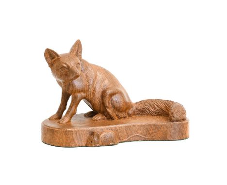 Workshop of Robert Mouseman Thompson (Kilburn): An English Oak Fox, carved by Stan Dodds (1928-2012) in a seated pose, on an 