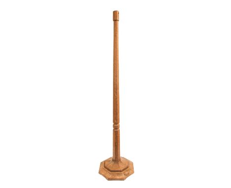 Workshop of Robert Mouseman Thompson (Kilburn): An English Oak Standard Lamp, octagonal column and base, with carved mouse tr