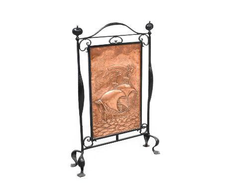An Arts &amp; Crafts Wrought Iron and Copper Firescreen, attributed to John Pearson, the copper panel repoussé decorated with