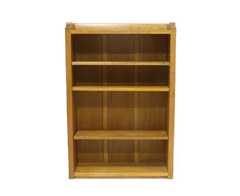 Workshop of Robert Mouseman Thompson (Kilburn): An English Oak 4ft Open Bookcase, solid ends and panelled back, with raised u