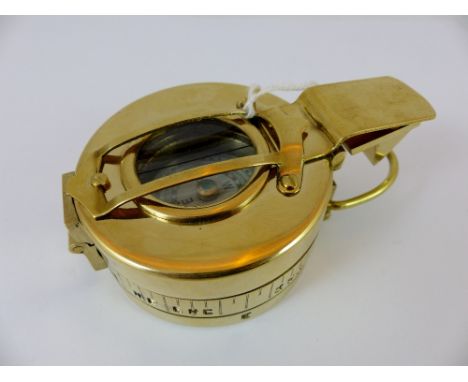 Heavy brass compass by T.E. Co Ltd, crows foot mark to base