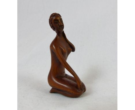 Hand carved and signed netsuke of nude lady in seated position