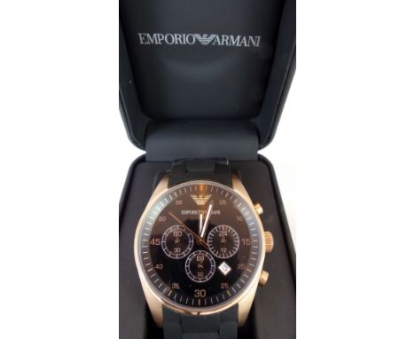 Emporio Armani chronograph wristwatch with multi-dial black face with a rose gold surround on a black rubber strap. RRP £379.