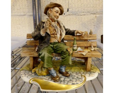 Capodimonte figure of a tramp on a bench