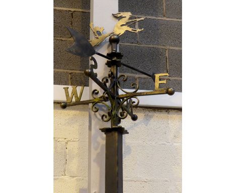 Large wrought iron weather vane with flying witch silhouette on metal mounting pole. Vane: 80 x 65 cm. Pole: 280 cm.