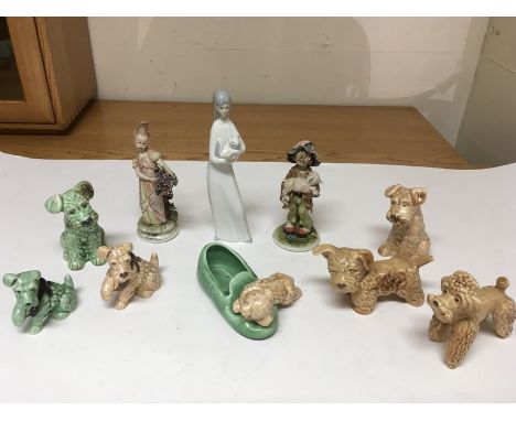 A collection of Sylvac dogs, two Capodimonte figures and a Spanish porcelain figure