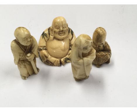 A Carved Japanese Netsuke Ivory, in the form of a Buddha, and three other smaller Ivory figures.