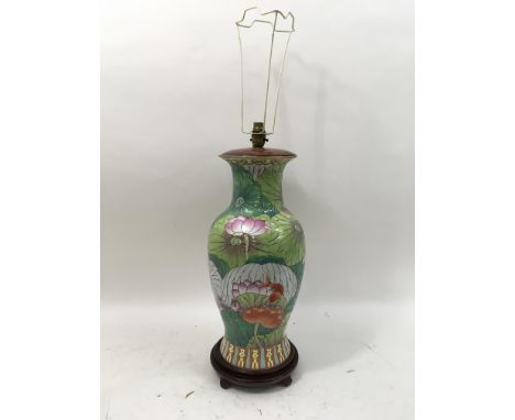 A reproduction oriental vase converted into a lamp. Height 20 inches.