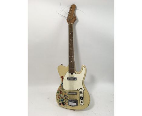 A vintage Judson electric guitar with hand painted flowers and motifs.