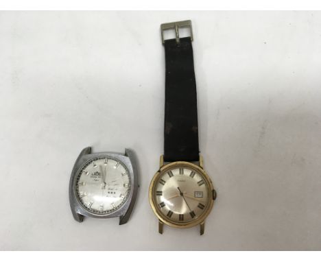 Two vintage watches. One of them a Timex.