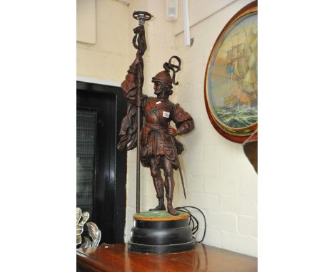 A large Spelter figure of a Knight holding a lamp height 90cm not including base,