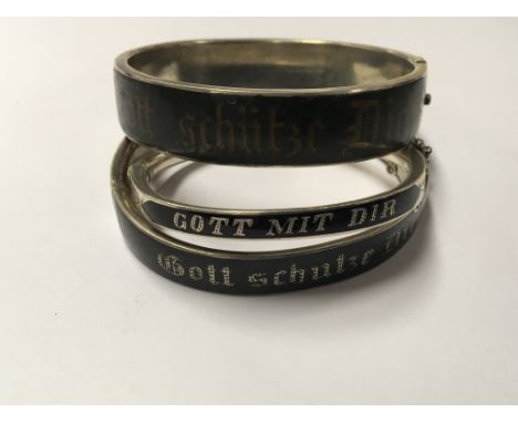 Three Imperial German silver and black enamel bangles with the inscription Gott Schutze dich. (3)