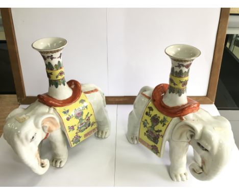 A pair of decorative ceramic elephants vases.Approximately 27cm high