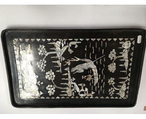 A vintage paper mache tray inlaid with oriental mother' o pearl scene of girl in a boat on river scene