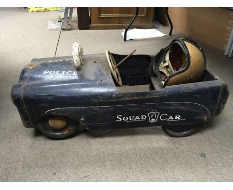 A vintage Police pedal car, with crash helmet. A/F