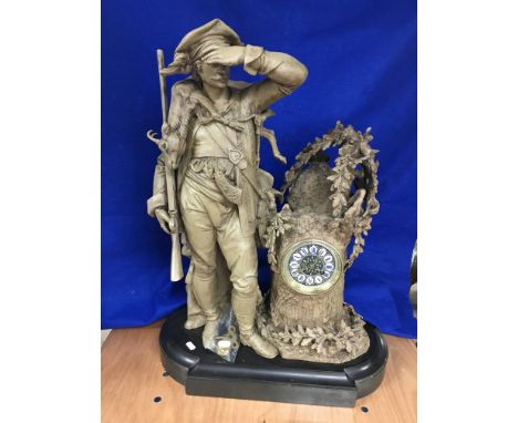 A French Spelter Huntsman Figural clock with 8 day movement and enamel dial.