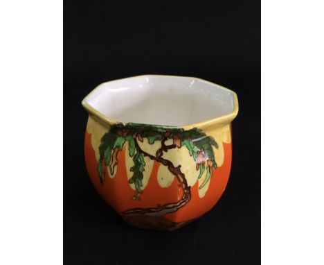 A Wilkinson pottery 'Memory Lane' small shaped edge jardiniere, the orange ground painted with a stylised tree.Approximately 