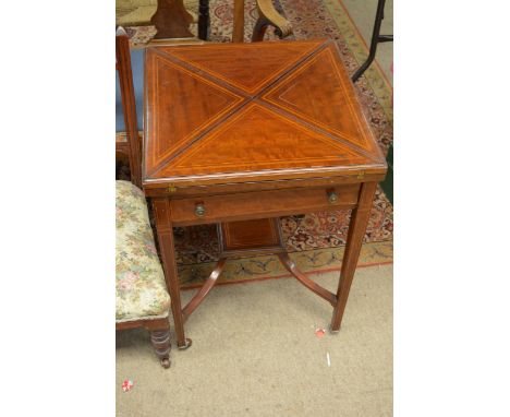 An Edwardian inlaid Mahogany Envelope card table with a single drawer on square tapering legs.