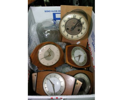 A box containing vintage electric clocks a continental wall clock a glass dome,