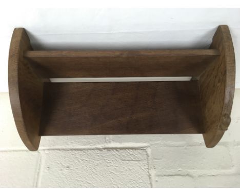 A Robert Thompson Mouseman oak book shelf, applied with typical carved mouse to one end.Approximately 46cm