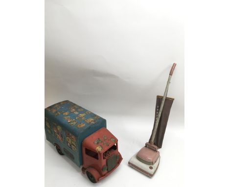 A vintage Tri-ang tin plate truck and a toy hoover