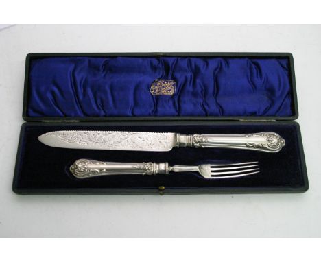 A cased set of silver presentation knife and fork by a William Hutton & Sons Ltd. silver blade and zhilt hallmarked 1899