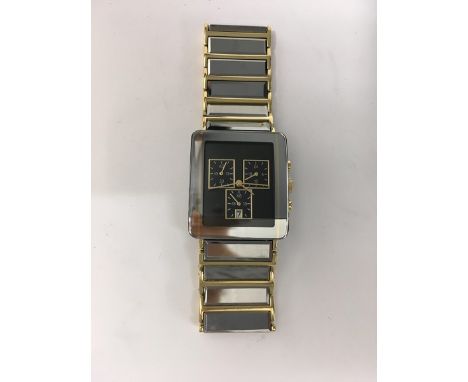 A boxed Gents Tungsten chronograph watch with square face and 3 dials including date, with mirrored surround and gold tone an