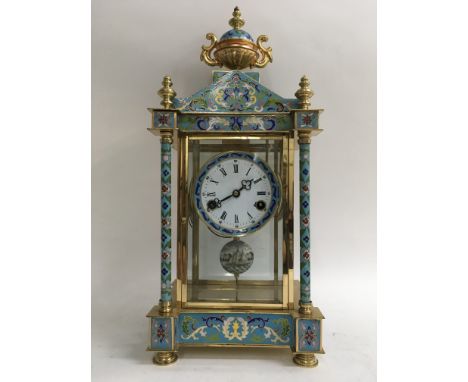 A French 8 day bracket clock with enamel cloisonnŽ decoration to the case with gilt metal finial. The pendulum painted with a