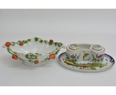 A 19th century porcelain inkwell, painted in the manner of Chelsea with fancy birds, approximately 22cm long, some damage. So