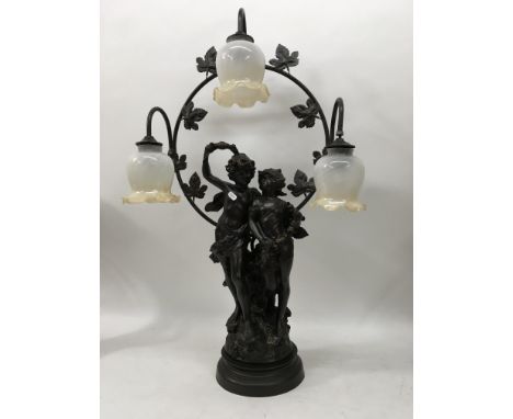 A reproduction lamp depicting young lovers.
