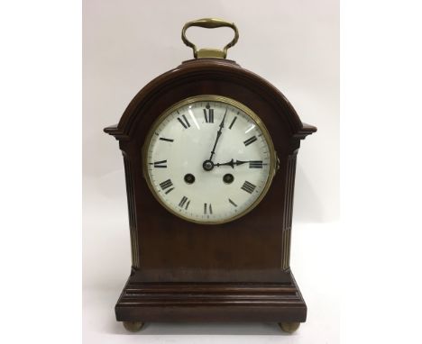 An enamel dial mantel clock