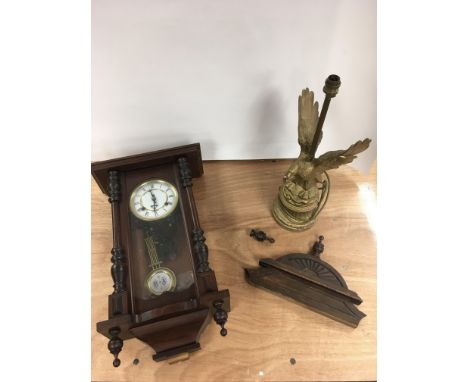 A wall clock and spelter lamp formed as an eagle