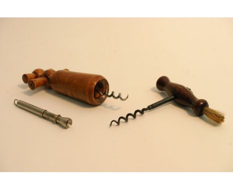 An antique corkscrew fitted with brush, a vintage corkscrew and a cigar piercer (3).