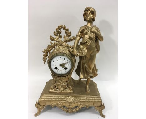 A French gilt spelter figurative mantel clock with painted enamel dial.Approximately 44cm high