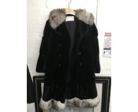 A vintage fur coat, label for Higgs Furs.
