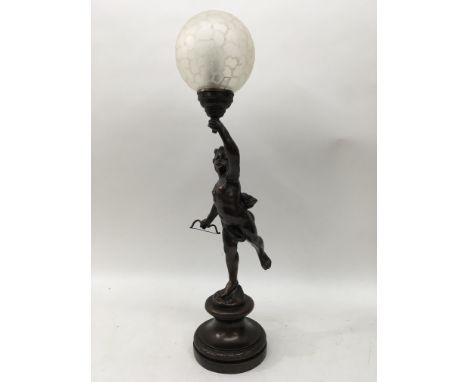 A reproduction lamp depicting a cherub.