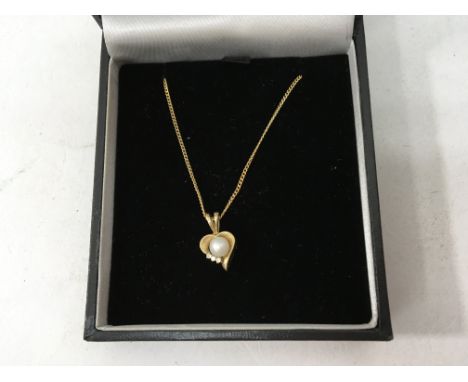 A 9ct gold diamond and pearl necklace.