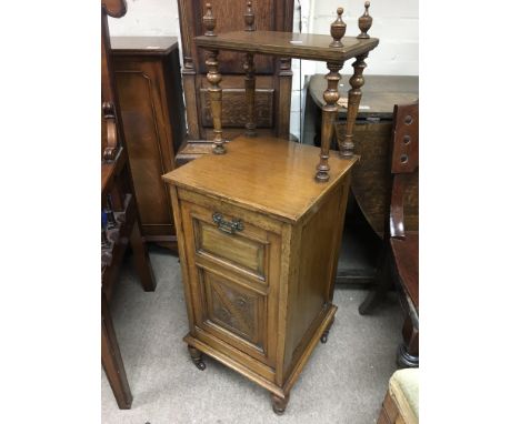 An Edwardian carved oak coal box with fitted shelf above,, approx 105cm x 36cm x 37cm.