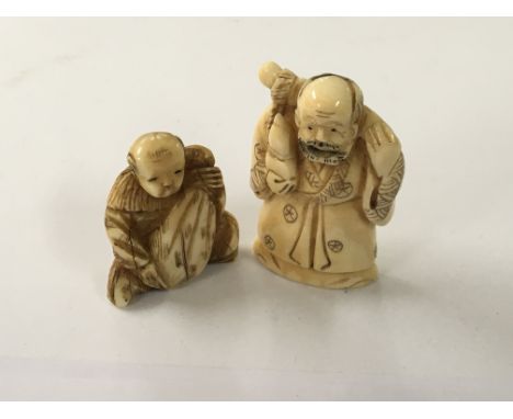 A Japanese carved Ivory Netsuke in the form of an elder and one other in the form of a juvenile figure (2)