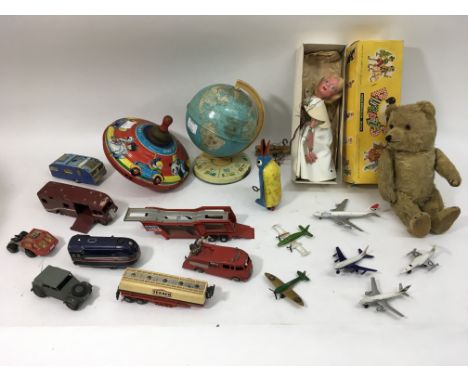 A collection of play worn Dinky and die cast models, a fairy Pelham puppet, a tin globe and spinning top,teddy bear and a clo