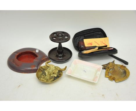A collection of vintage smoking accoutrements including ashtrays, Madison real Briar pipe and stand