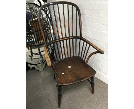 An Elm stick back chair.