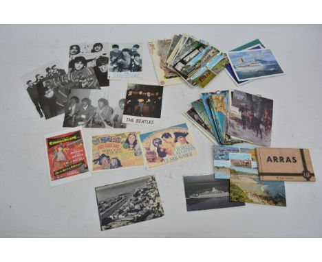 An assortment of various vintage postcards including examples depicting The Beatles