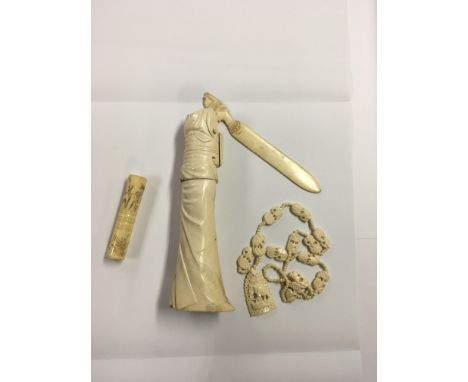 19th Century Ivory parasol handle, Ivory paper knife, part of a Japanese geisha girl figure and a carved elephant necklace. (