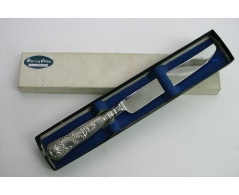 A sterling silver cake knife in original box