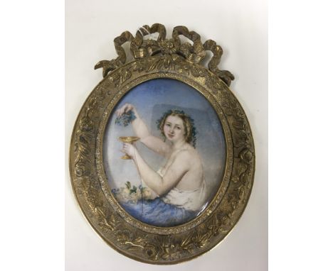 A fine quality early 19th century oval ivorene portrait miniature of a classical maiden holding grapes, signed H.P.Heedmans 1